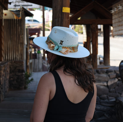 Handmade Gemini Emerald birthstone hat. A meaningful zodiac gift with western, one-of-a-kind style.